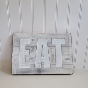 EAT wooden sign.